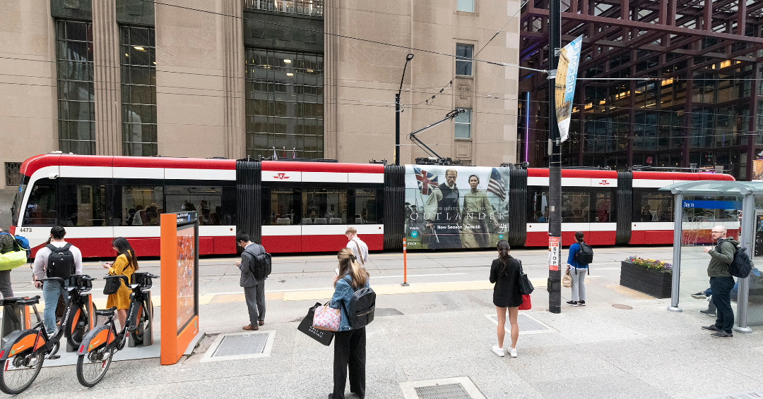 Scanning QR code in an OOH advertising campaign Transit Shelter AMIR MIRI